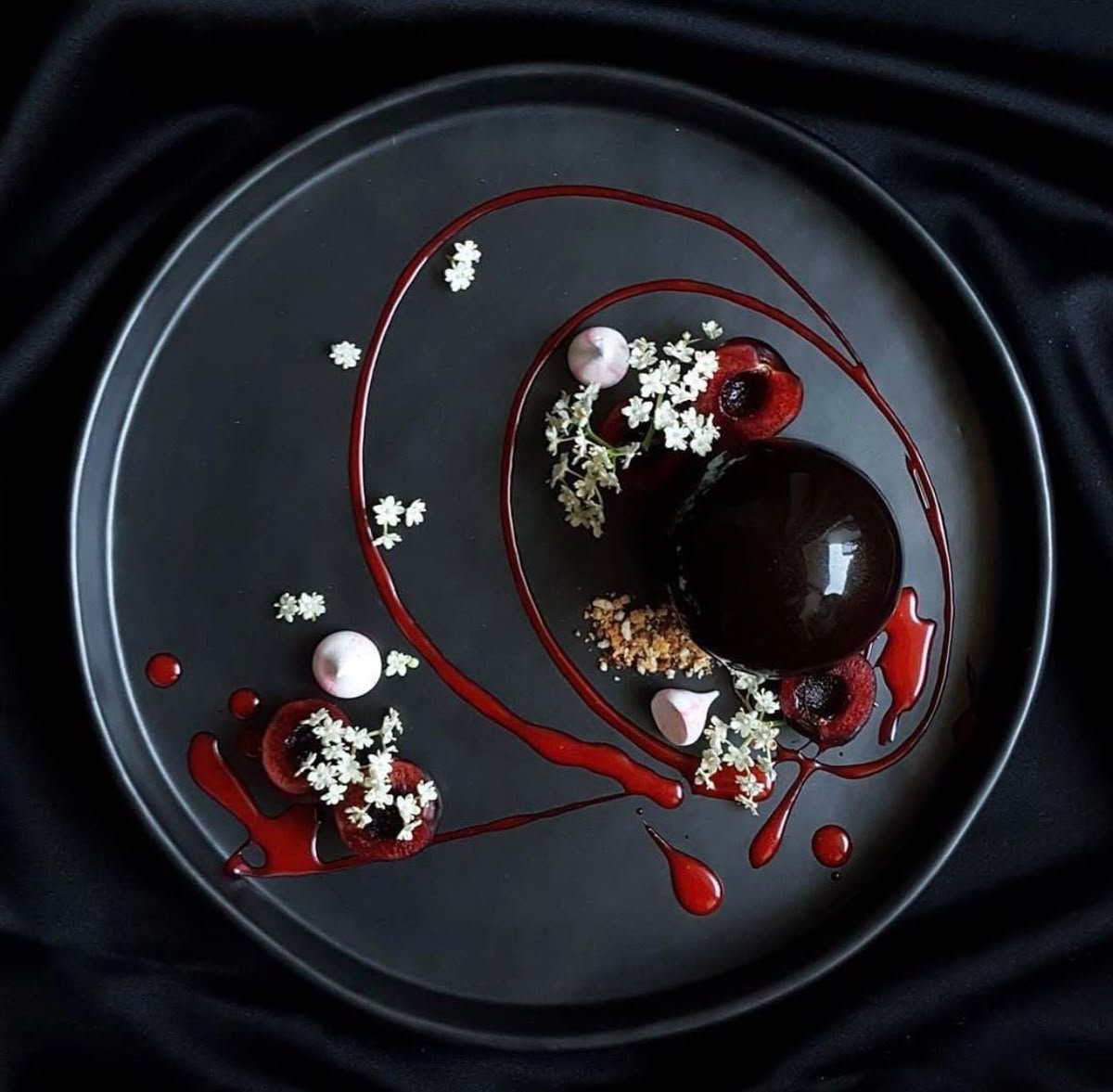 Chocolate dome with cherry coulis